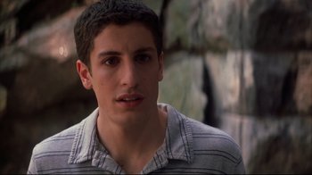 Movie still from “Anything Else” (2003), directed by Woody Allen – A young man with a mustache is looking at the camera; Close Up shot, High angle