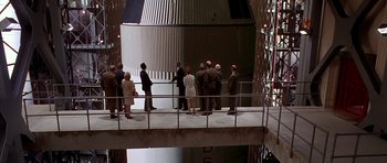 Movie still from “Apollo 13” (1995), directed by Ron Howard – A group of people standing on top of a platform; Wide shot, High angle