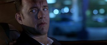 Movie still from “Apollo 13” (1995), directed by Ron Howard – A person in a suit; Close Up shot, Over the shoulder angle