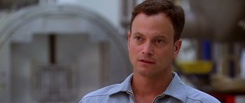 Movie still from “Apollo 13” (1995), directed by Ron Howard – A person wearing a blue shirt; Close Up shot, Over the shoulder angle