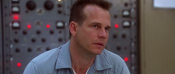 Movie still from “Apollo 13” (1995), directed by Ron Howard – A person wearing a blue shirt; Close Up shot, Low angle