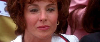 Movie still from “Apollo 13” (1995), directed by Ron Howard – A woman's face with brown hair and green eyes; Close Up shot, Over the shoulder angle