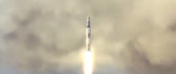 Movie still from “Apollo 13” (1995), directed by Ron Howard – An image of a rocket taking off in the sky; Extreme Wide shot, Low angle