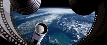 Movie still from “Apollo 13” (1995), directed by Ron Howard – A view of the earth taken from a space station window; Extreme Wide shot, Overhead angle