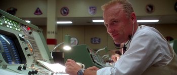 Movie still from “Apollo 13” (1995), directed by Ron Howard – A man sitting in front of a computer monitor; Close Up shot, Low angle
