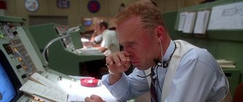 Movie still from “Apollo 13” (1995), directed by Ron Howard – A man in a white shirt and a red neck tie; Close Up shot, Low angle