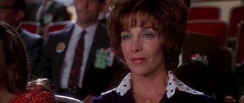 Movie still from “Apollo 13” (1995), directed by Ron Howard – A person wearing a purple shirt; Close Up shot, Over the shoulder angle