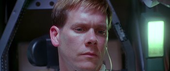 Movie still from “Apollo 13” (1995), directed by Ron Howard – A person wearing a headset; Close Up shot, Low angle