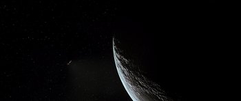 Movie still from “Apollo 13” (1995), directed by Ron Howard – An image of an earth from space taken at night; Extreme Wide shot, High angle