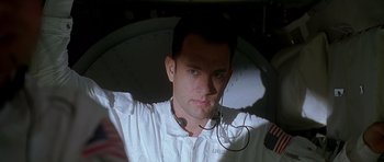 Movie still from “Apollo 13” (1995), directed by Ron Howard – A person wearing a headset; Close Up shot, Low angle