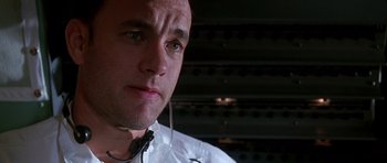 Movie still from “Apollo 13” (1995), directed by Ron Howard – A person wearing a headset; Close Up shot, Low angle