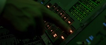 Movie still from “Apollo 13” (1995), directed by Ron Howard – A hand is pointing to a computer keyboard; Extreme Close Up shot, Overhead angle