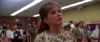 Movie still from “Apollo 13” (1995), directed by Ron Howard – A person wearing a dress; Close Up shot, Over the shoulder angle