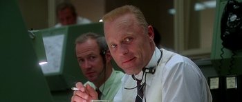 Movie still from “Apollo 13” (1995), directed by Ron Howard – A man in a white shirt and a man in a black tie; Close Up shot, Low angle