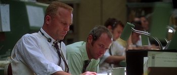 Movie still from “Apollo 13” (1995), directed by Ron Howard – A group of men sitting at a computer desk; Close Up shot, Low angle