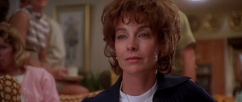 Movie still from “Apollo 13” (1995), directed by Ron Howard – A person wearing a jacket; Close Up shot, Over the shoulder angle