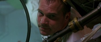 Movie still from “Apollo 13” (1995), directed by Ron Howard – A man's face while looking into a mirror; Close Up shot, Low angle