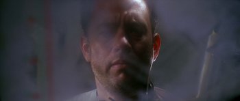 Movie still from “Apollo 13” (1995), directed by Ron Howard – A person wearing a headset; Extreme Close Up shot, Low angle