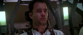 Movie still from “Apollo 13” (1995), directed by Ron Howard – A person wearing a headset; Close Up shot, Low angle