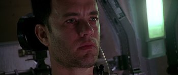 Movie still from “Apollo 13” (1995), directed by Ron Howard – A man's face while wearing headphones; Close Up shot, Low angle