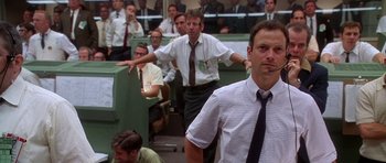 Movie still from “Apollo 13” (1995), directed by Ron Howard – A group of men standing in front of a crowd; Medium shot, Low angle