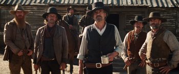 Movie still from “Appaloosa” (2008), directed by Ed Harris – A group of men standing next to each other on a street; Medium shot, Low angle