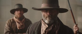 Movie still from “Appaloosa” (2008), directed by Ed Harris – A person with a beard wearing a hat; Close Up shot, Low angle