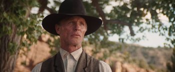 Movie still from “Appaloosa” (2008), directed by Ed Harris – An older man wearing a hat and a vest; Close Up shot, Low angle