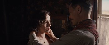 Movie still from “Appaloosa” (2008), directed by Ed Harris – A man and a woman looking at one another; Close Up shot, Over the shoulder angle