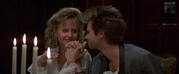 Movie still from “April Fool's Day” (1986), directed by Fred Walton – A man and a woman holding hands and looking at each other; Close Up shot, Over the shoulder angle