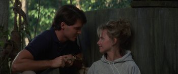 Movie still from “April Fool's Day” (1986), directed by Fred Walton – A man and a woman talking to each other; Medium shot, Over the shoulder angle