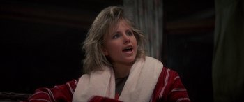 Movie still from “April Fool's Day” (1986), directed by Fred Walton – A woman with a towel around her neck; Close Up shot, Low angle