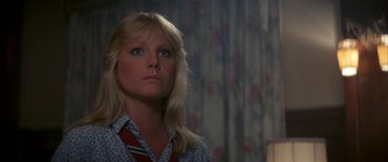 Movie still from “April Fool's Day” (1986), directed by Fred Walton – A woman with long blonde hair looking up at the sky; Close Up shot, Low angle