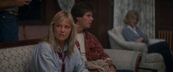 Movie still from “April Fool's Day” (1986), directed by Fred Walton – A man and a woman sitting next to each other on a couch; Close Up shot, Over the shoulder angle