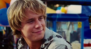 Movie still from “Aquamarine” (2006), directed by Elizabeth Allen Rosenbaum – A person sitting in front of a table; Close Up shot, Over the shoulder angle