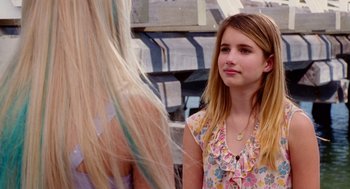 Movie still from “Aquamarine” (2006), directed by Elizabeth Allen Rosenbaum – A young girl standing next to a blond haired woman; Close Up shot, Over the shoulder angle