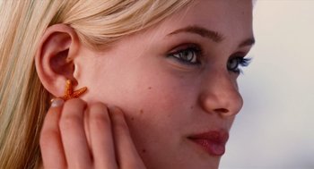 Movie still from “Aquamarine” (2006), directed by Elizabeth Allen Rosenbaum – A person wearing a earring; Close Up shot, Low angle