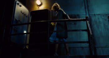 Movie still from “Aquamarine” (2006), directed by Elizabeth Allen Rosenbaum – A woman walking down a flight of stairs; Wide shot, Low angle