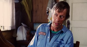 Movie still from “Aquamarine” (2006), directed by Elizabeth Allen Rosenbaum – A person wearing a blue shirt; Close Up shot, Over the shoulder angle