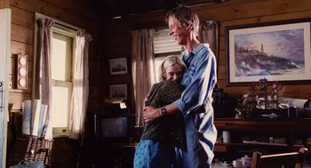 Movie still from “Aquamarine” (2006), directed by Elizabeth Allen Rosenbaum – A man and a woman hugging in a living room; Medium shot, Low angle
