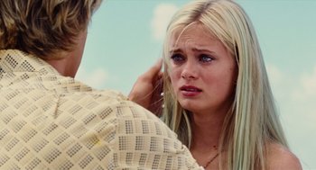 Movie still from “Aquamarine” (2006), directed by Elizabeth Allen Rosenbaum – A young blonde woman is crying as a man touches her hair; Close Up shot, Over the shoulder angle