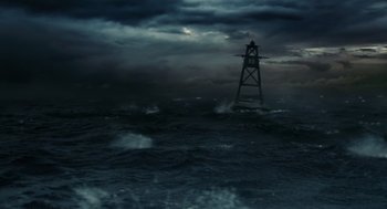 Movie still from “Aquamarine” (2006), directed by Elizabeth Allen Rosenbaum – A lighthouse in the middle of the ocean with dark clouds; Extreme Wide shot, High angle