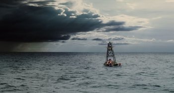 Movie still from “Aquamarine” (2006), directed by Elizabeth Allen Rosenbaum – A boat floating in the middle of a body of water; Extreme Wide shot, High angle