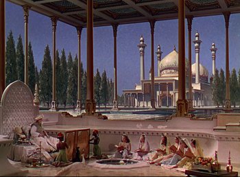 Movie still from “Arabian Nights” (1942), directed by John Rawlins – An oil painting of people sitting around a pool of water in front of a building with domes; Extreme Wide shot, High angle