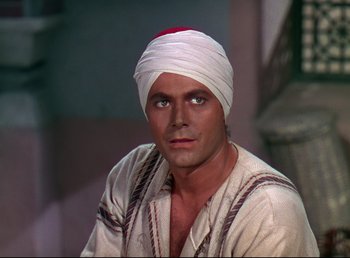 Movie still from “Arabian Nights” (1942), directed by John Rawlins – A person wearing a turban; Close Up shot, High angle