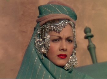 Movie still from “Arabian Nights” (1942), directed by John Rawlins – A person wearing a headdress; Close Up shot, Low angle