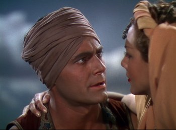 Movie still from “Arabian Nights” (1942), directed by John Rawlins – A man and a woman are looking at one another; Close Up shot, Low angle