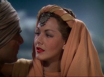 Movie still from “Arabian Nights” (1942), directed by John Rawlins – A person wearing a headpiece; Close Up shot, Over the shoulder angle