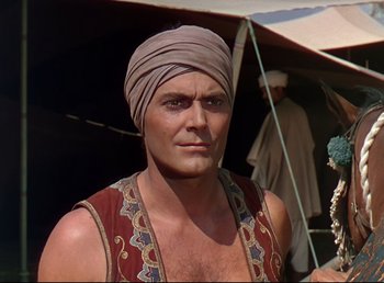 Movie still from “Arabian Nights” (1942), directed by John Rawlins – A person wearing a turban; Close Up shot, Low angle