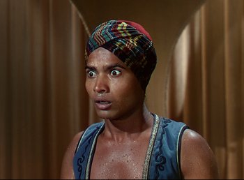Movie still from “Arabian Nights” (1942), directed by John Rawlins – A person wearing a turban; Close Up shot, High angle